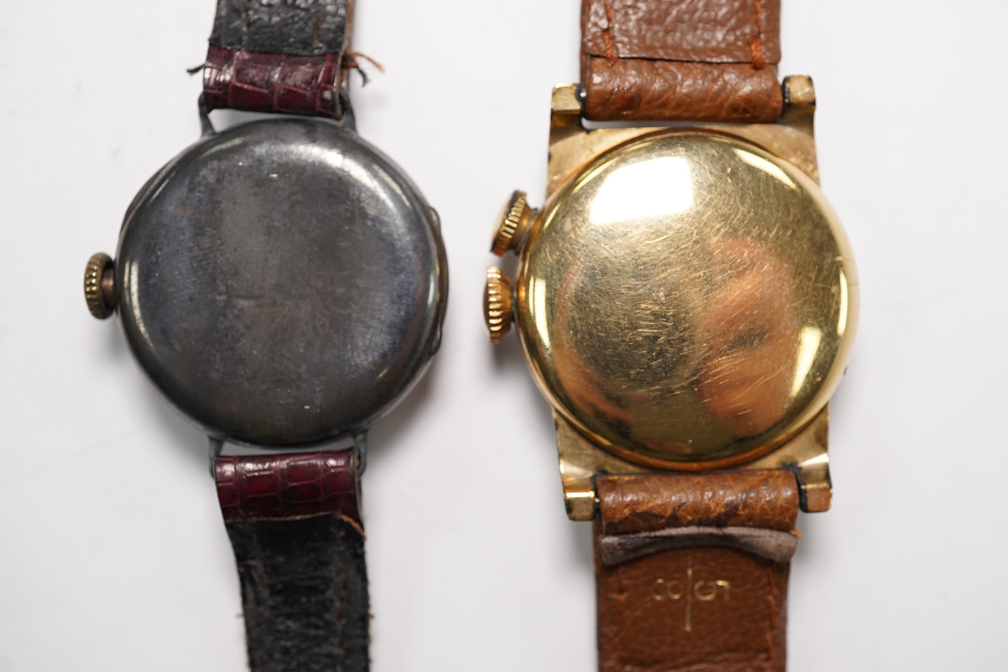 A gentleman's 1940's 10k gold filled Longines Weems? manual wind wrist watch, lacking dial, case diameter 28mm, together with a lady's silver wrist watch. Condition - poor to fair